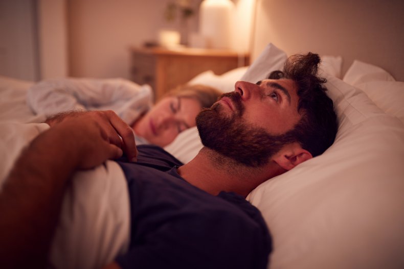 Man in bed awake
