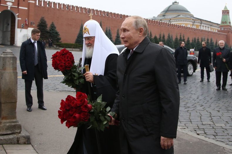 Russian President Vladimir Putin marks the National