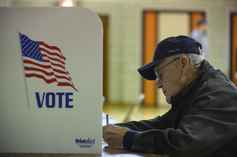 A man fills his ballot