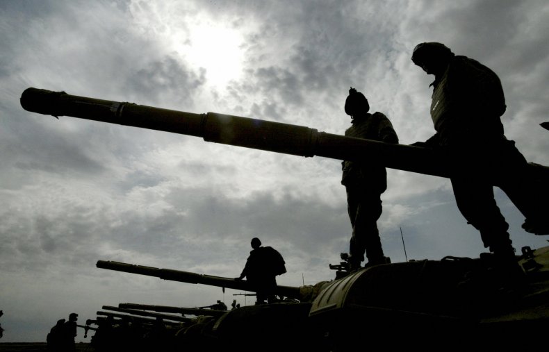 Soldiers on tanks