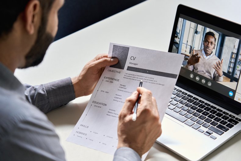 A man being interviewed over computer.