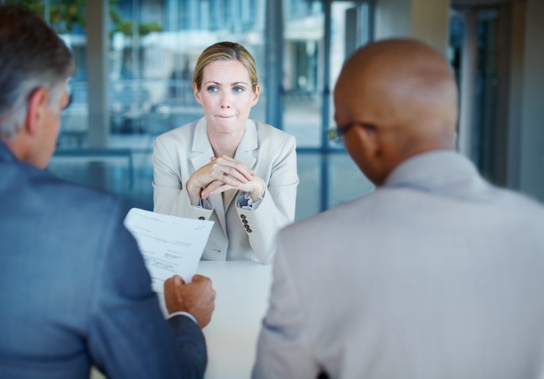 A woman looking nervous in an interview.