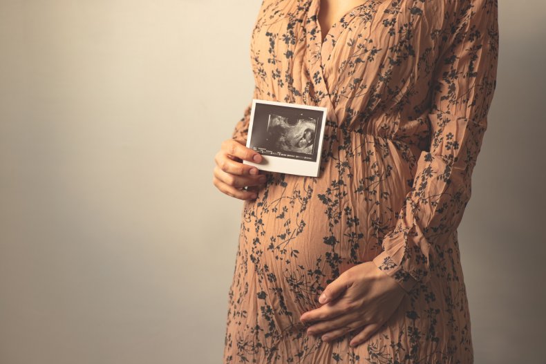 Woman with ultrasound picture