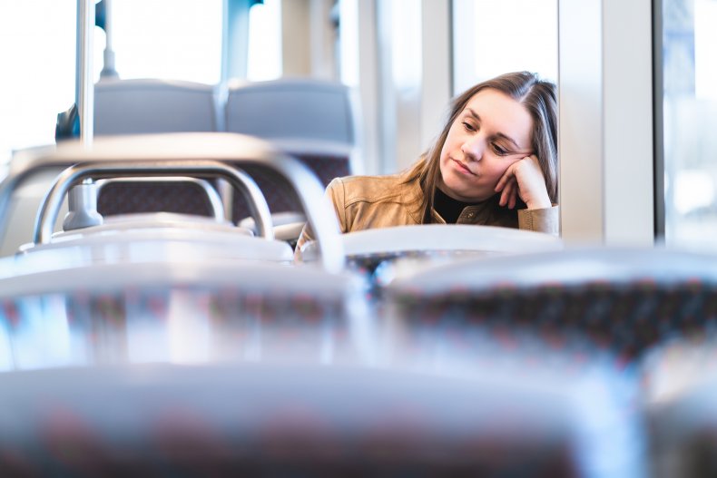 Disappointed woman on train