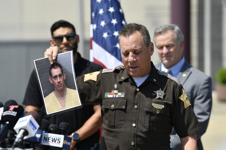 Sheriff With Photo of Casey White