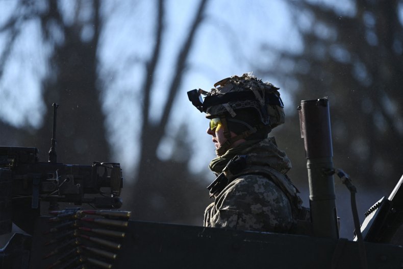 A Ukrainian soldier in an armored vehicle