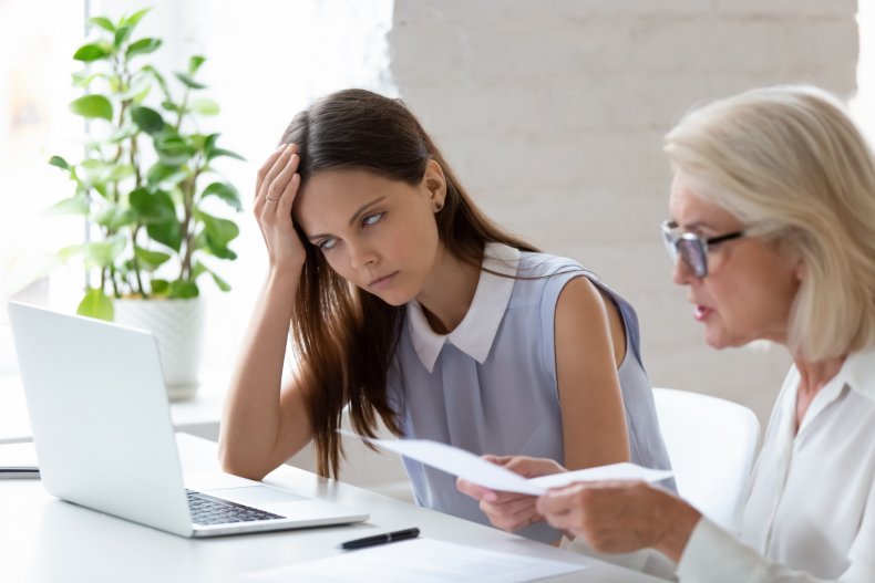 Employee rolling eyes at boss