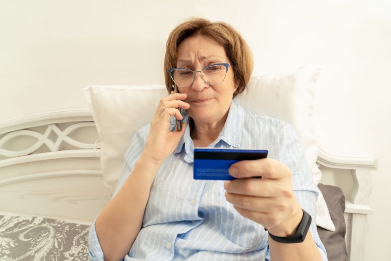 Woman on phone with card