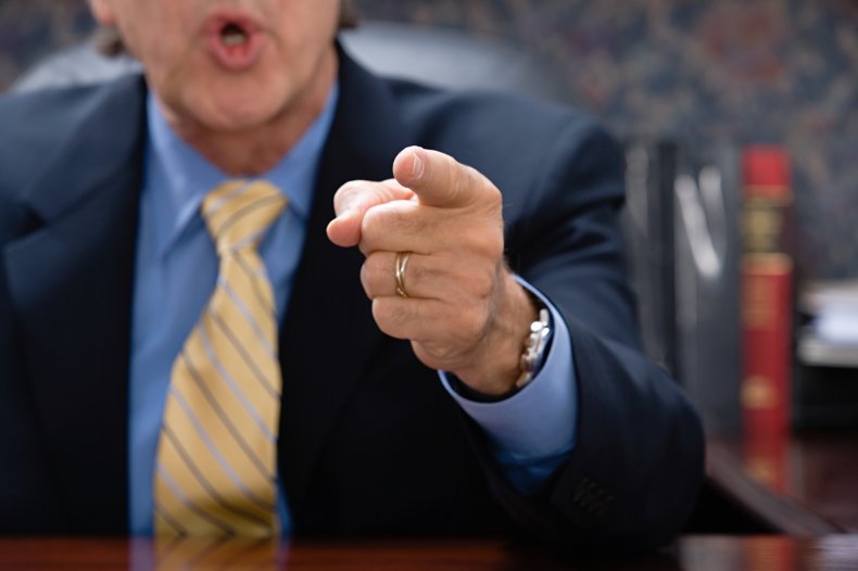 A man pointing finger at someone. 