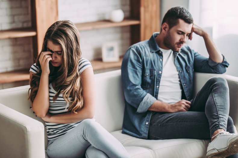 Upset couple on couch