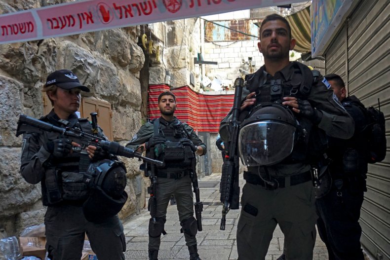 Israeli security forces stand guard after a