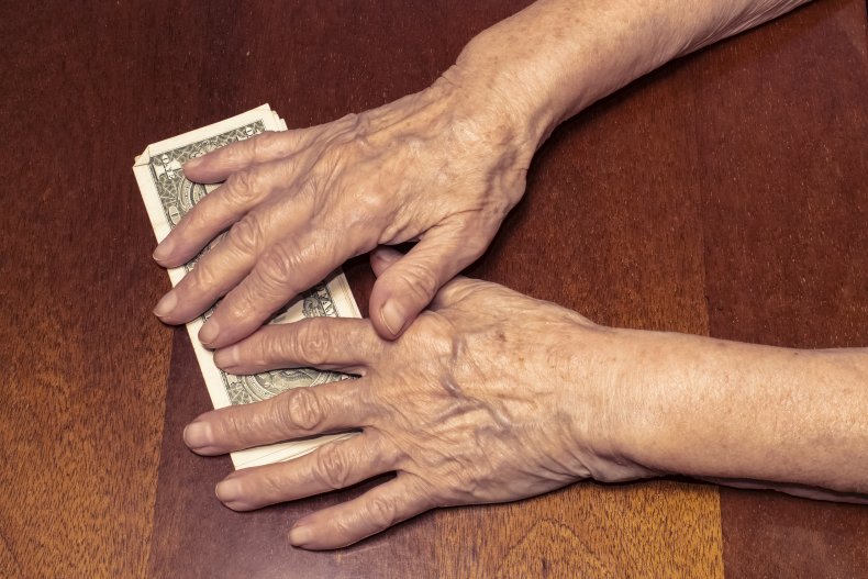 File photo of woman holding money.