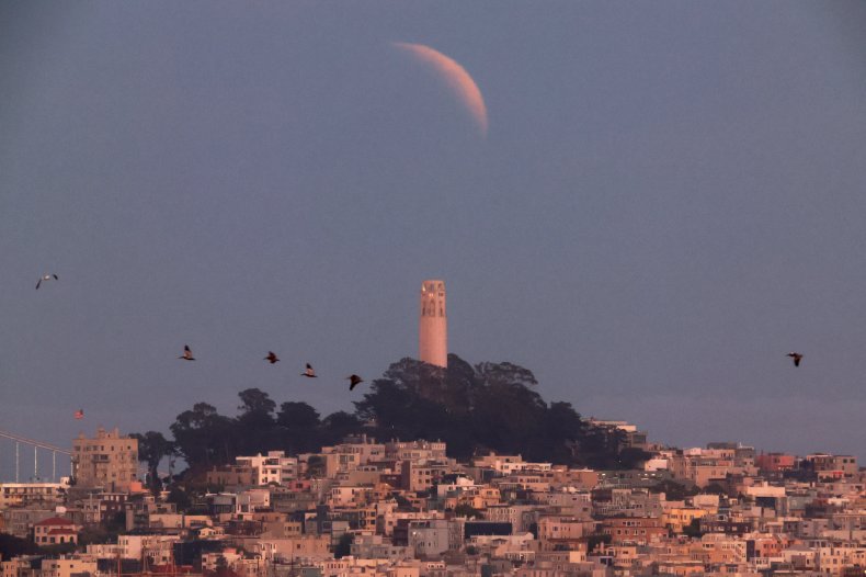 Partial lunar eclipse over Coit Tower
