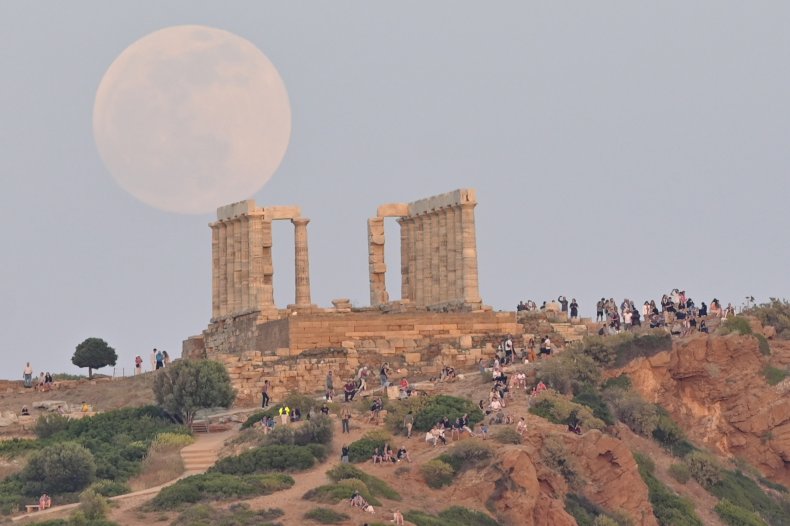 Full moon rising above Athens, Greece