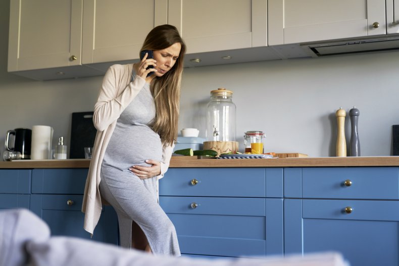 Pregnant woman arguing on phone