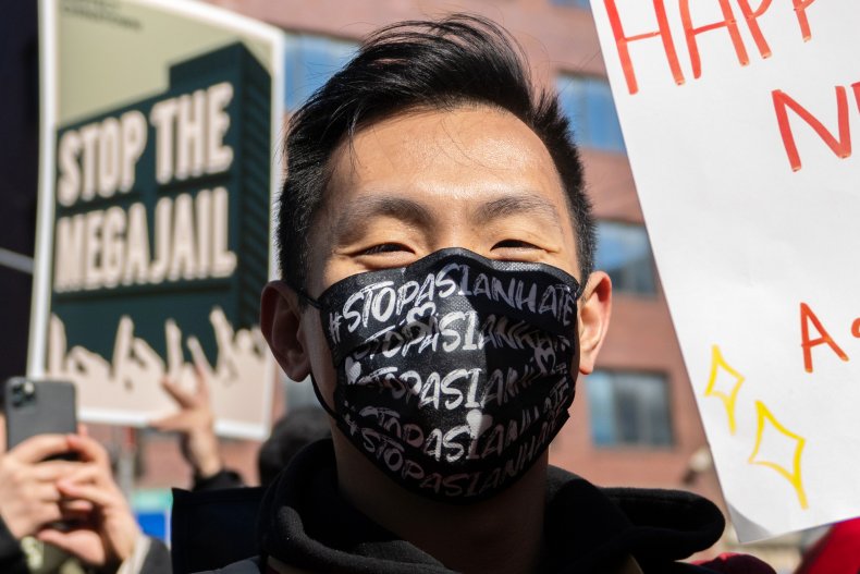 A person wearing "Stop Asian hate" mask