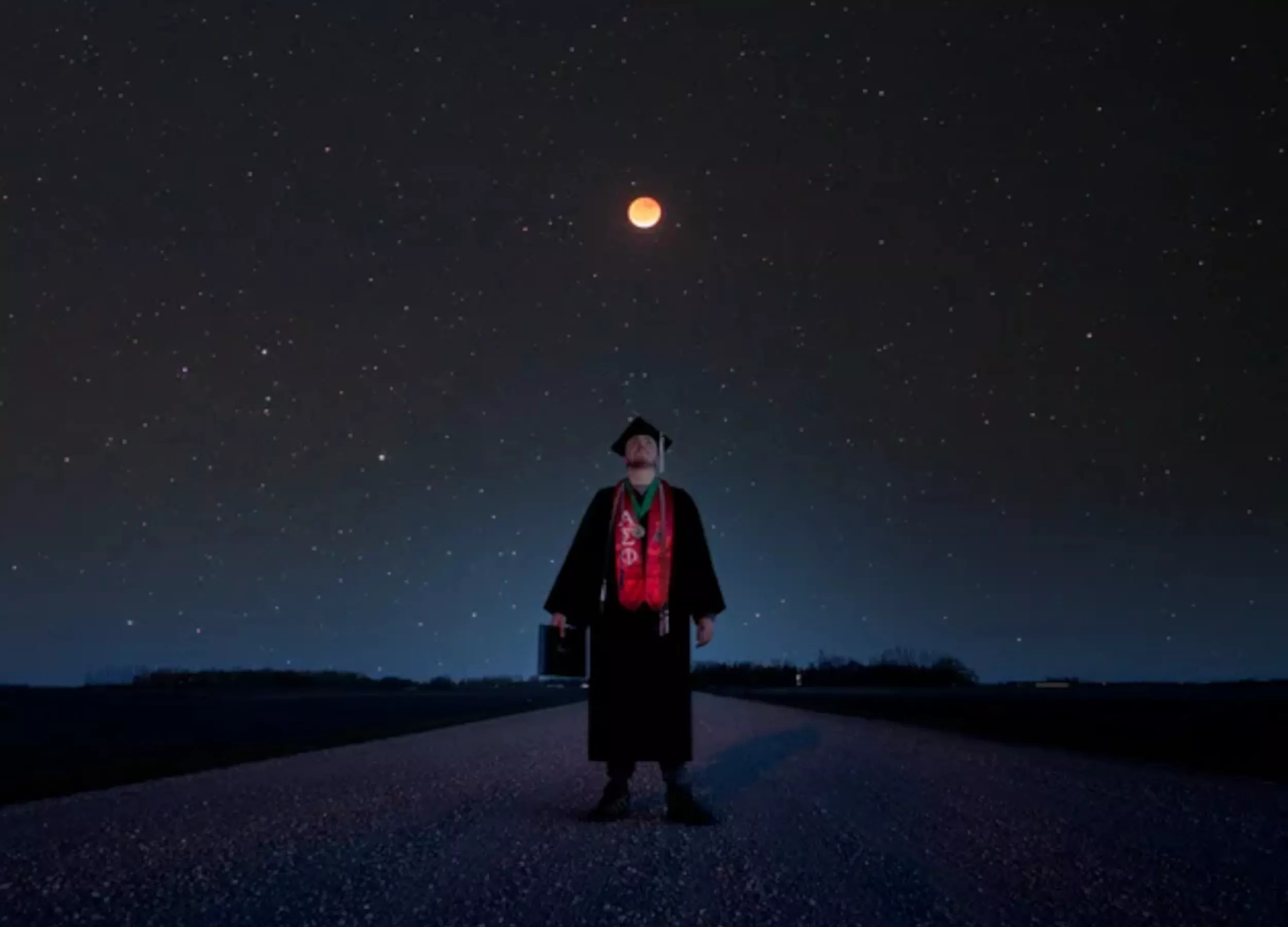 Man Captures 'Out of This World' Graduation Photo Featuring Lunar Eclipse - Vimarsana News