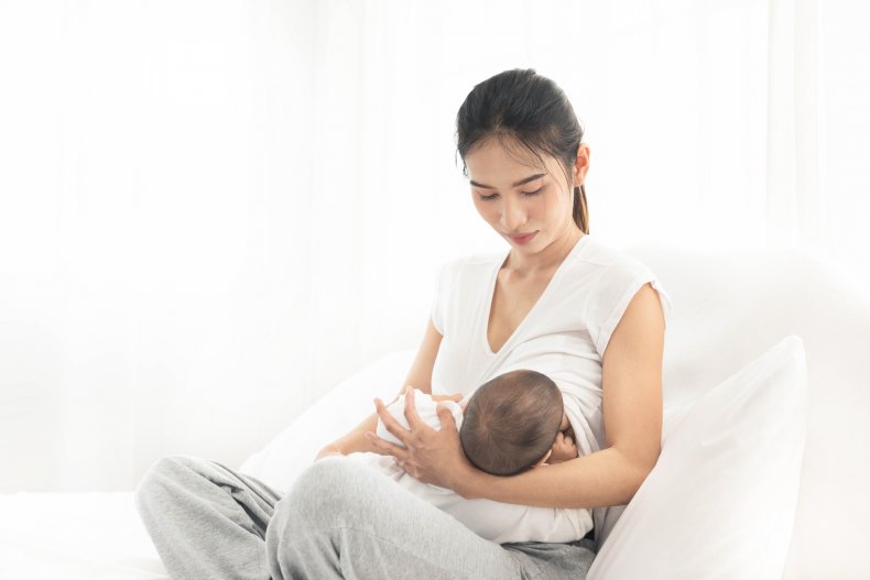Husband helping wife with breastfeeding problems