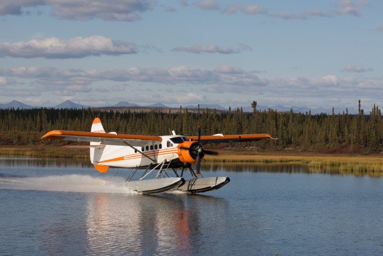 Seaplane landing in lake