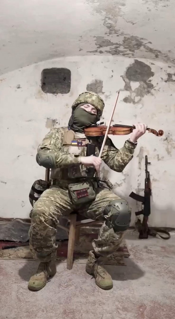Moysey Bondarenko plays the violin in the Ukrainian bunker