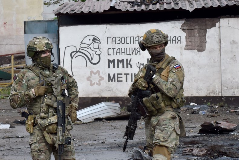 Russian soldiers in Mariupol patrolling
