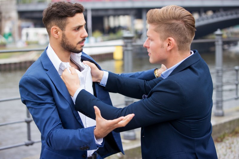 Men fighting in suits