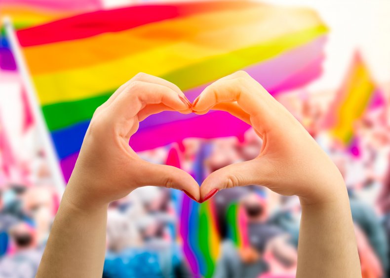 Supporting hands make heart sign and wave