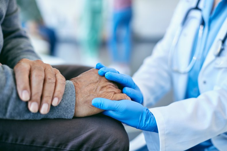Doctor holding patient's hand