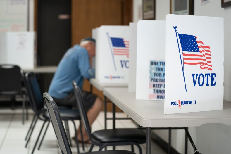 A man fills out a ballot at