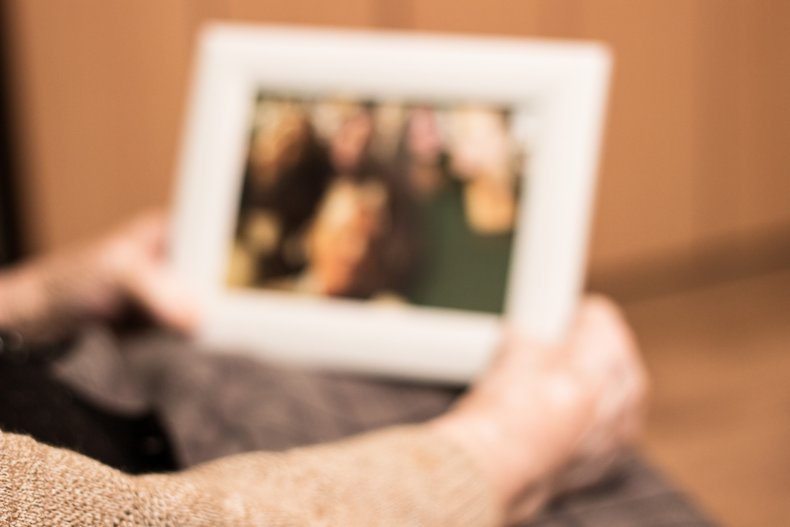 File photo of woman and photograph.