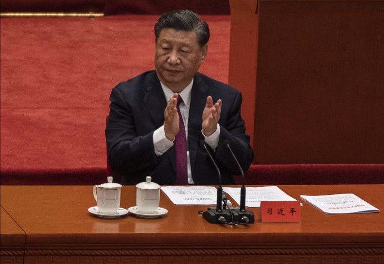 Chinese President Xi Jinping applauds during a