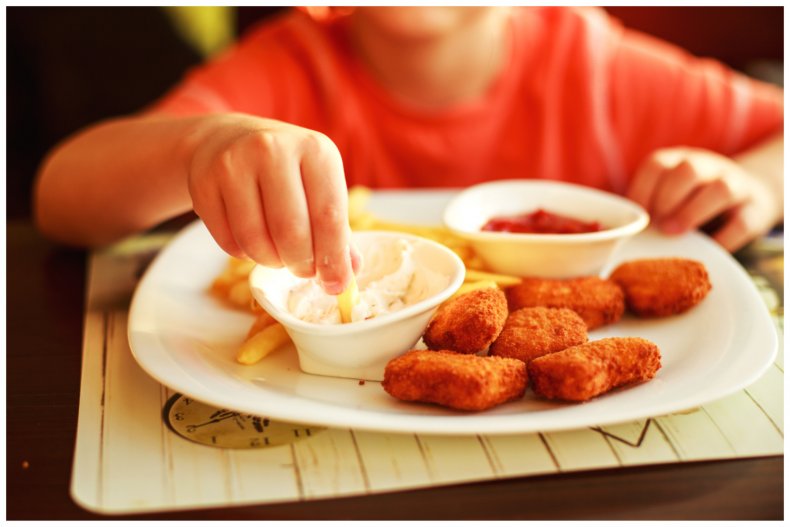 Stock image of child eating junk food