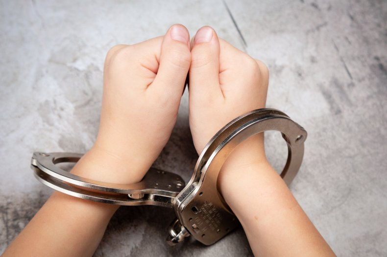 File photo of child in handcuffs.