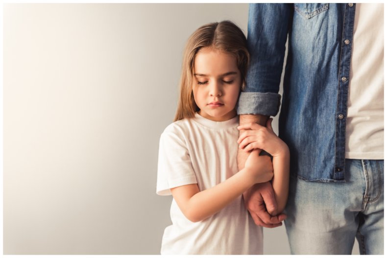 Stock image of a child holding an arm