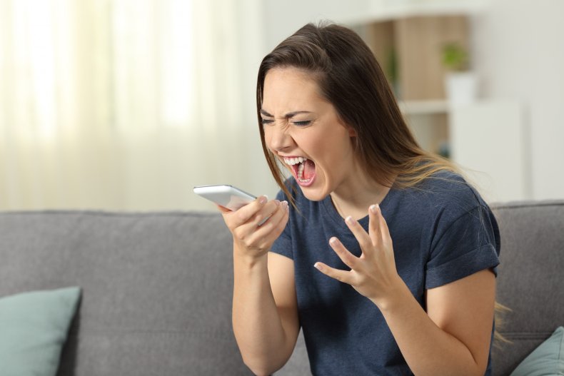 Woman screaming into telephone
