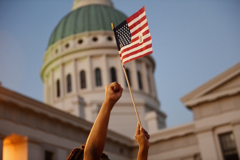 A child holds an American flag