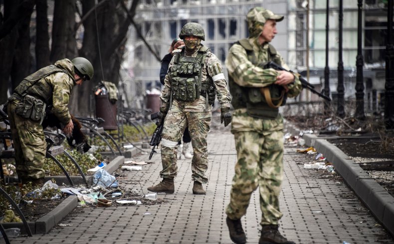 Russian soldiers patrol Mariupol 