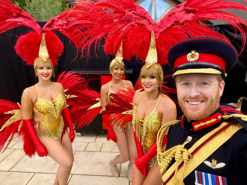 Prince Harry lookalike Rhys Whittock with performers.