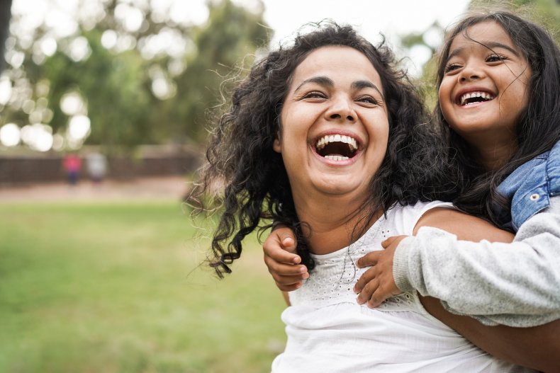 Woman and girl playing outside