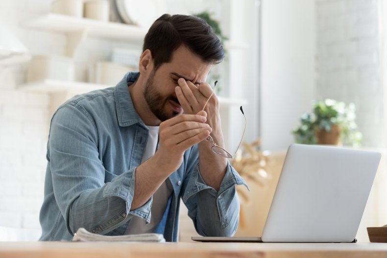 Upset man holding head