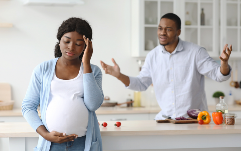 An upset pregnant woman and man.
