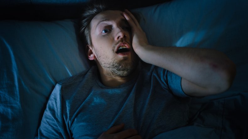 Man awakens from bad dream