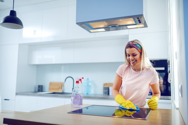 Woman cleaning kitchen