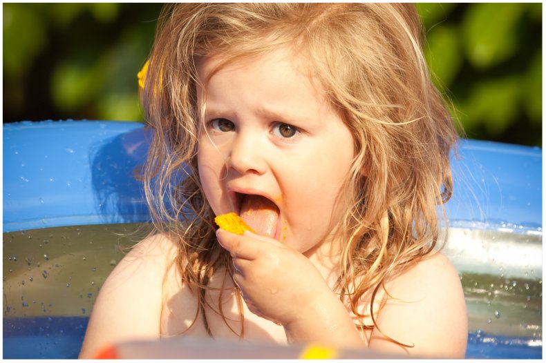 Stock image of child eating food