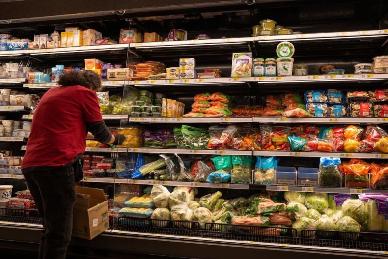 Grocery store worker stocking products