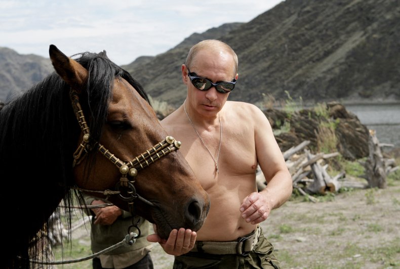 Vladimir Putin pictured topless with a horse