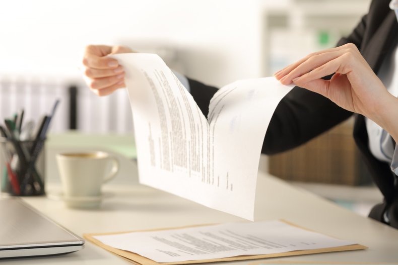Woman rips contract in office