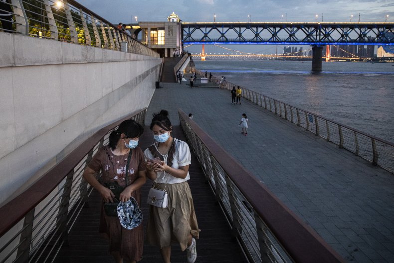 Residents wear masks while watching the scenery