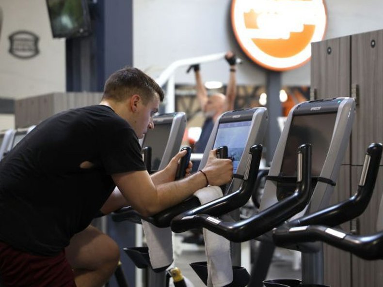 Man riding stationary bike