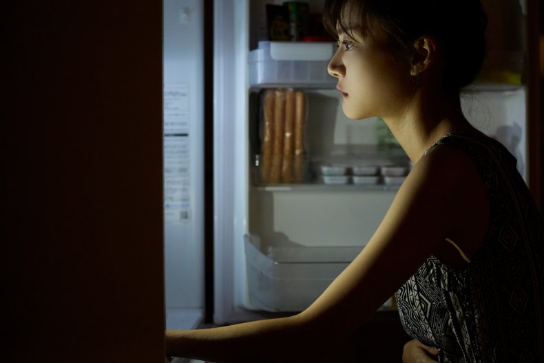 Woman looking in the fridge 